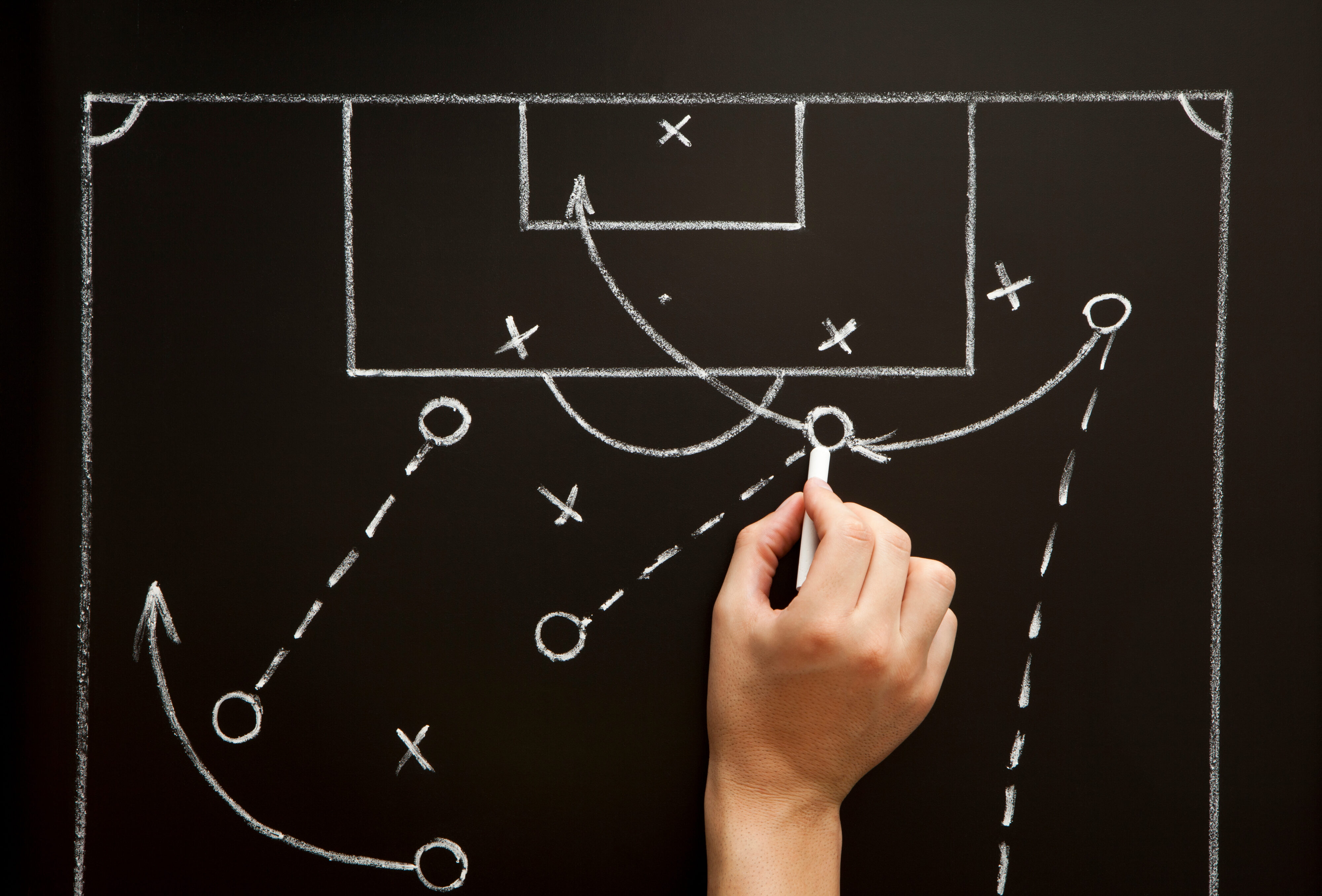 Man drawing a soccer game strategy